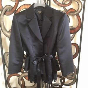 A beautiful, black, bold statement skirt suit